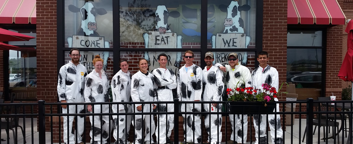 group of students in cow costumes