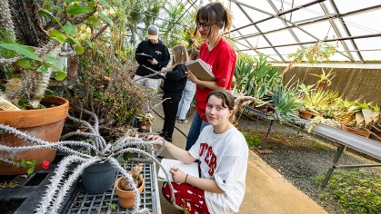 Undergraduate students in the floriculture greenhouse complex