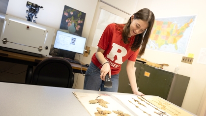 Cassandra Azurro digitizing plant specimen in the Chrysler Herbarium